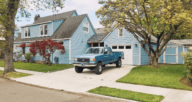 A paved driveway in front of a home with added value.