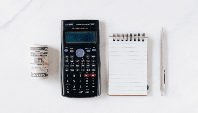 A calculator and notebook used to make an offer on a short sale.