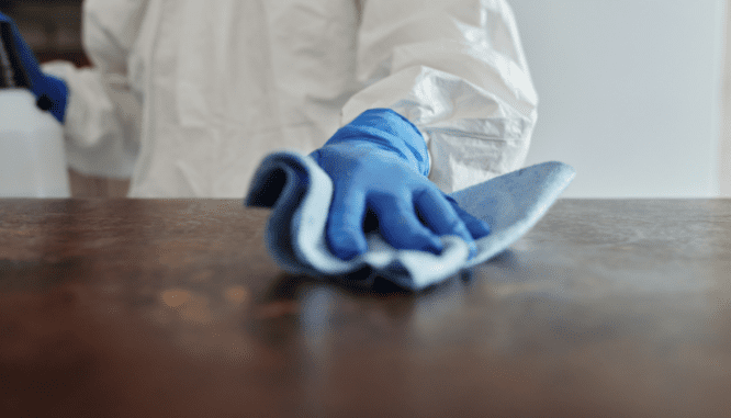 A person cleaning a house before selling.