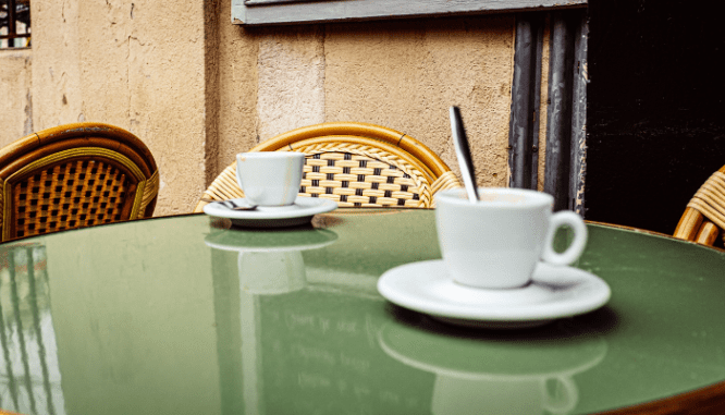 Coffee cups used by a parent and a child discussing downsizing.