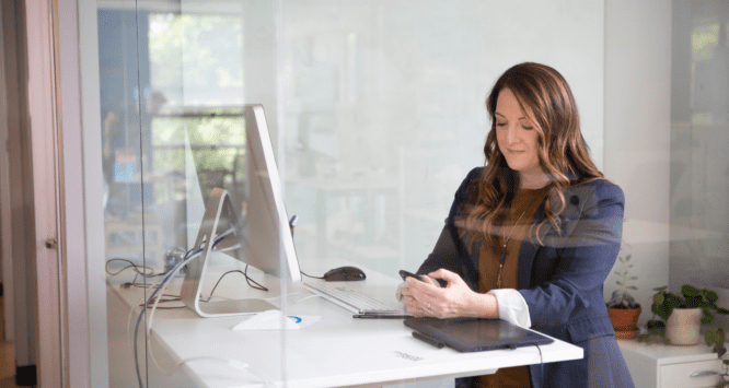 A woman using a computer to sell a house fast in Lexington.