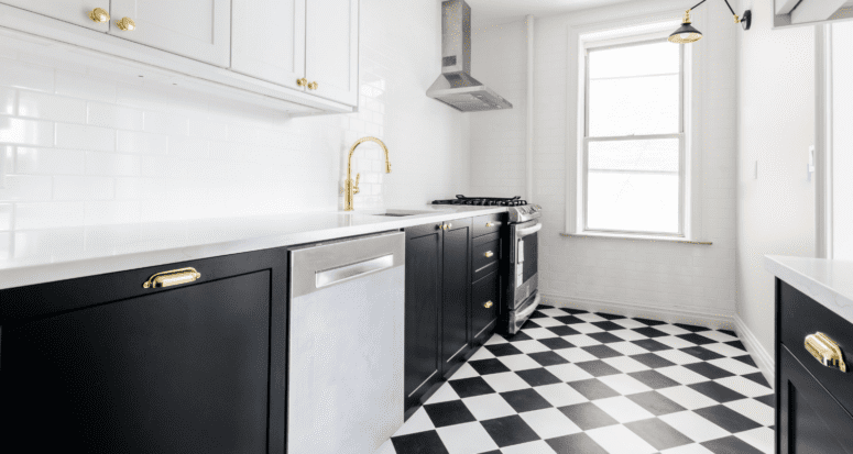 A kitchen with brass fixtures that are in style.