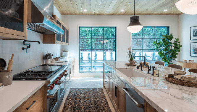 A kitchen with quart countertops that are in style.