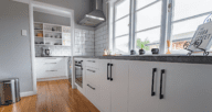 A kitchen with subway tiles that are in style.