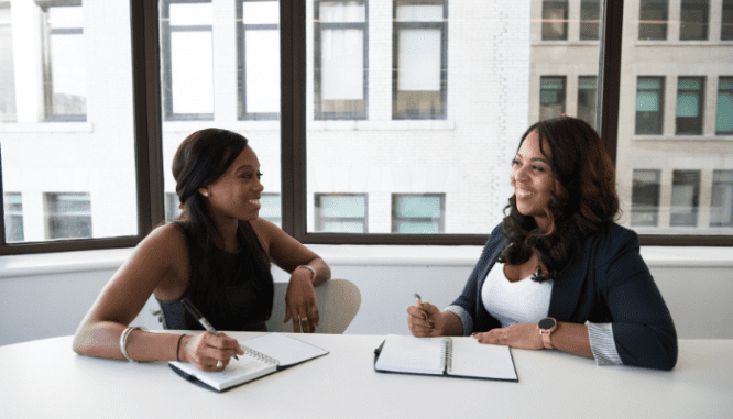 An agent and a client chatting about selling a mobile home.