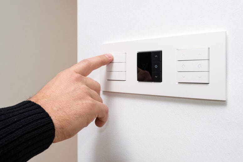 A dimmer switch in a home that is fixed.