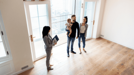 A couple working with a Realtor to sell a home.