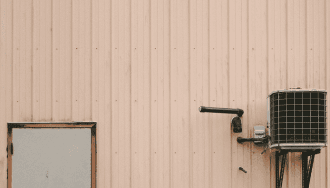 An air conditioning unit outside of a manufactured home.