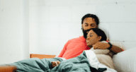 An image of a couple in bed to convey the importance of Evanston reparations.