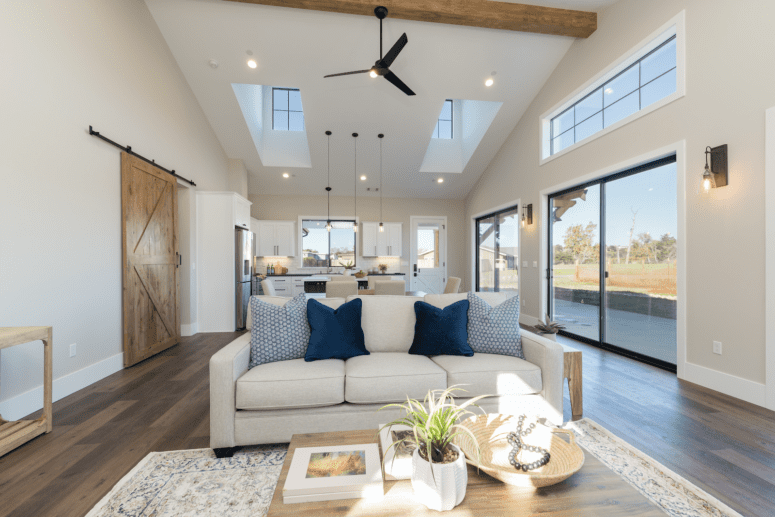 A great room with a ceiling fan that is not out of style.