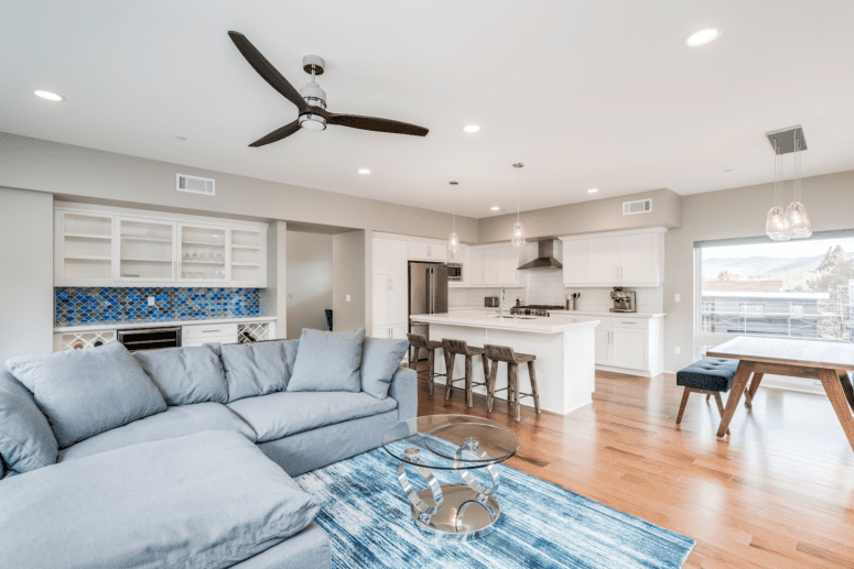 A living room with a ceiling fan that is not out of style