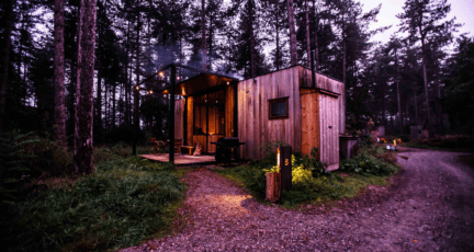 A backyard office behind a home.