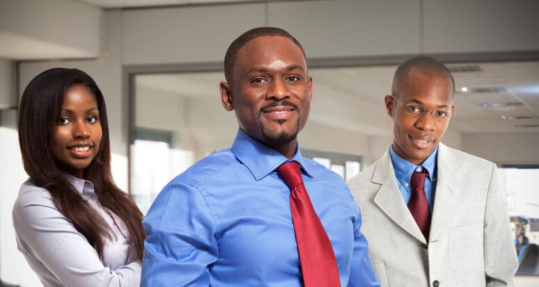 Black real estate agents working in the office.