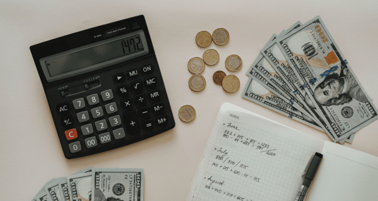 A calculator and notebook used to calculate homeowner tax breaks.