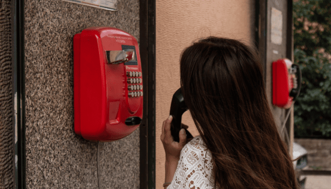 A client calling a good real estate agent on the phone.