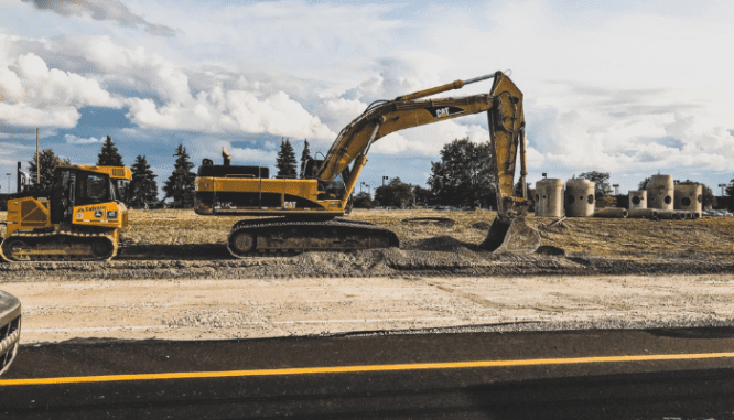 Construction on an empty lot to depict if it is cheaper to build or buy a house.