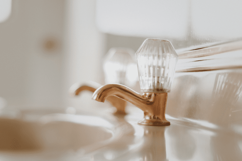 An image of a faucet used to demonstrate powder room ideas.