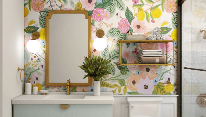 A vanity and colorful wallpaper used to model powder room ideas.