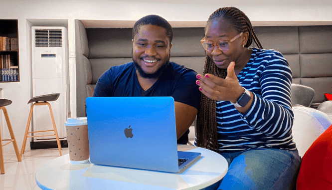 A couple researching selling their house online.