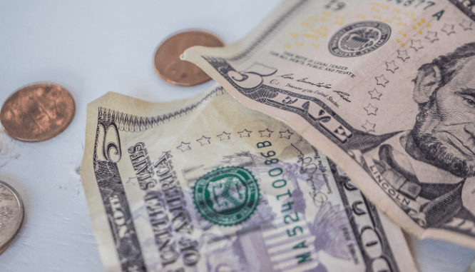 An image of money used to depict selling a rental property.