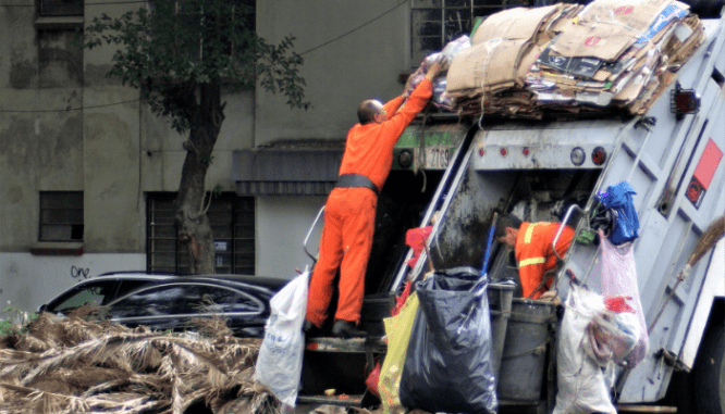 A garbage worker affected by disparate impact.