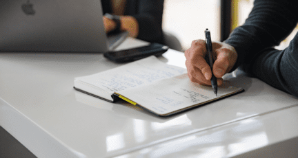 A seller using a notebook to review fha loans.