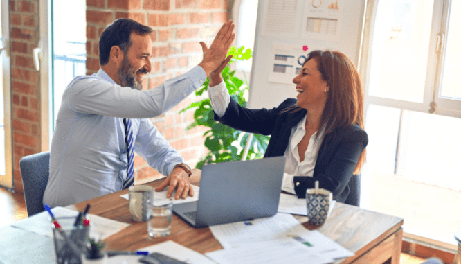 An image of two real estate agents to demonstrate who pays real estate agent commission.