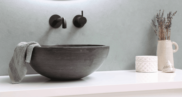 A floating sink that is not trendy in a bathroom.