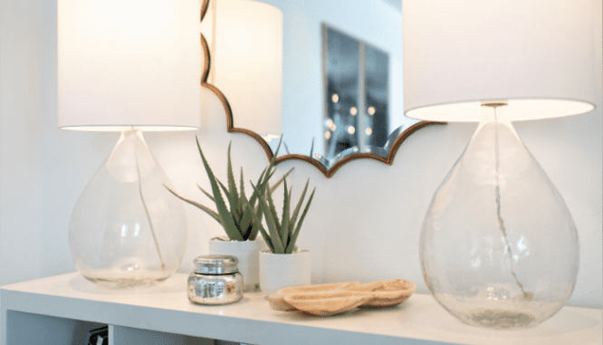 A table in a desert modern home with succulents.