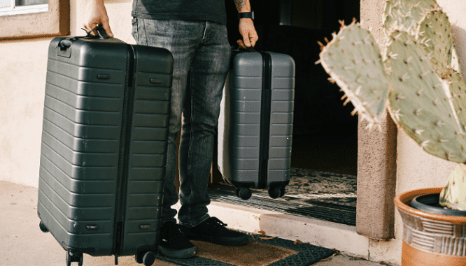 An image of a man with suitcases who has prepared a home emergency evacuation plan.