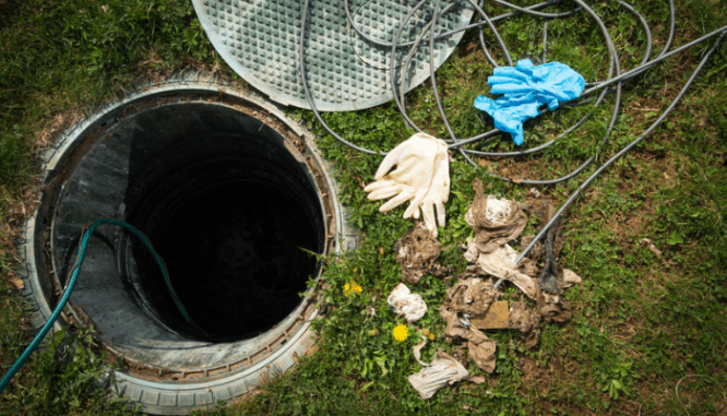 A septic tank that will be inspected near a house.