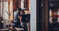 A man and a woman standing in a kitchen to demonstrate how homeowners insurance works.