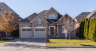 A house with an attached garage and added value.