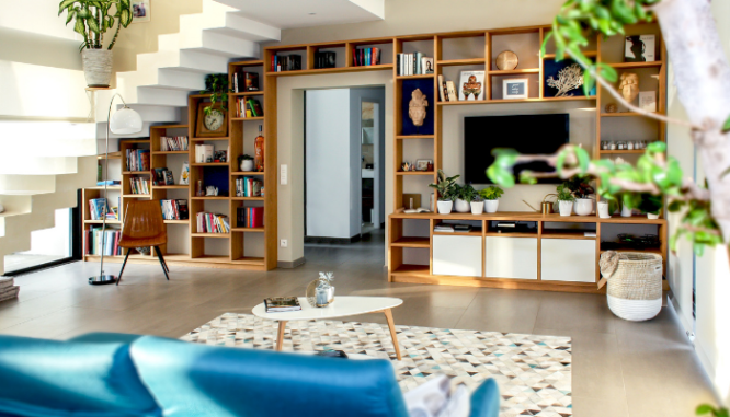 A living room with an open doorway to the other living areas in the home.