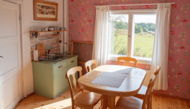 An image of a pink kitchenette.