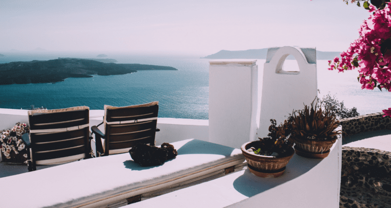 An image of a Mediterranean house overlooking the ocean.