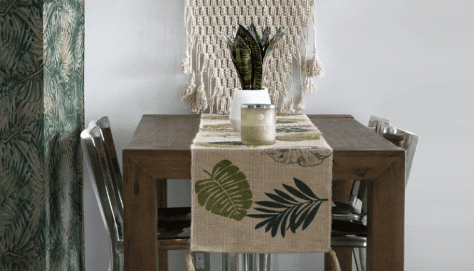 A table with palm tree motifs that fit the tropical modern decor.