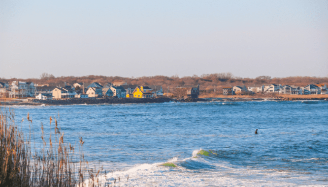 A beach near a Cape Cod house.