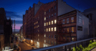 An image of a New York City apartment at night used to demonstrate what a pied-a-terre is.