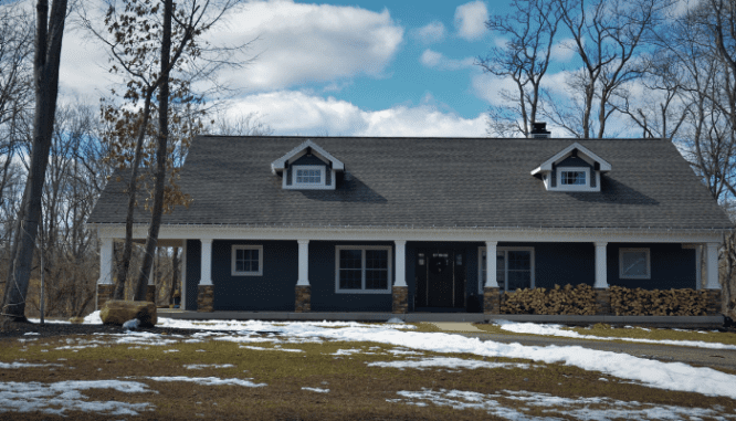 An image of a blue ranch house.