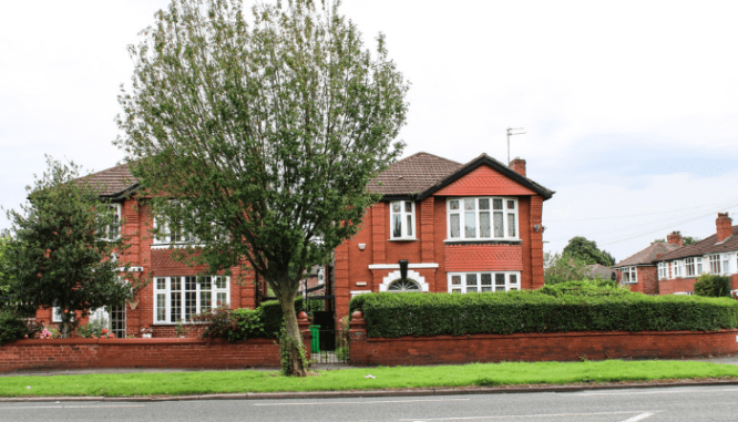 A luxury house purchased with a mortgage instead of with cash.