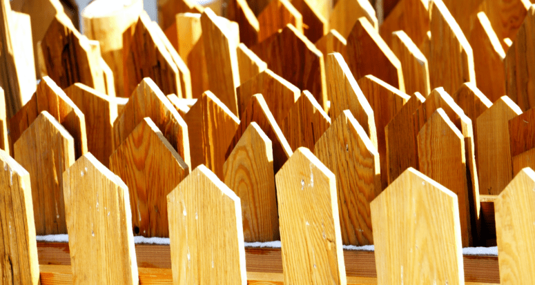 An image of a yellow fence to demonstrate how much it would cost to build a fence.