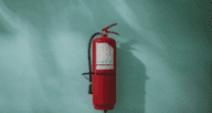 An image of a fire extinguisher to demonstrate how to prevent house fires and fire safety.