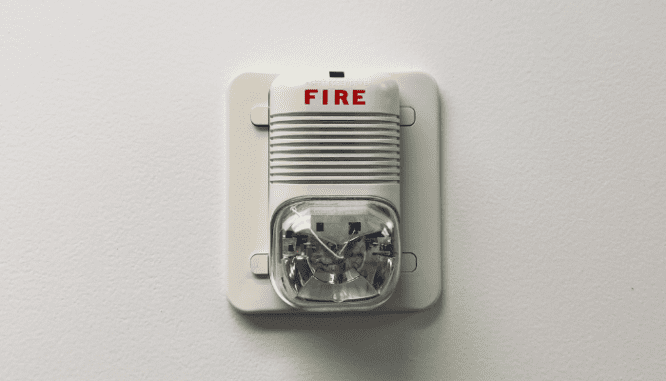 An image of a fire alarm to demonstrate how to decorate an indoor outdoor living space.