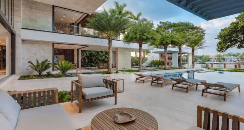 An image of a pool and house to demonstrate indoor outdoor space tips and design.