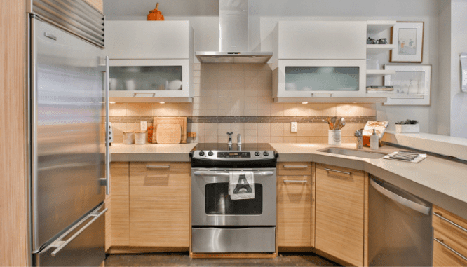 A newly remodeled kitchen featuring new cabinets and appliances.