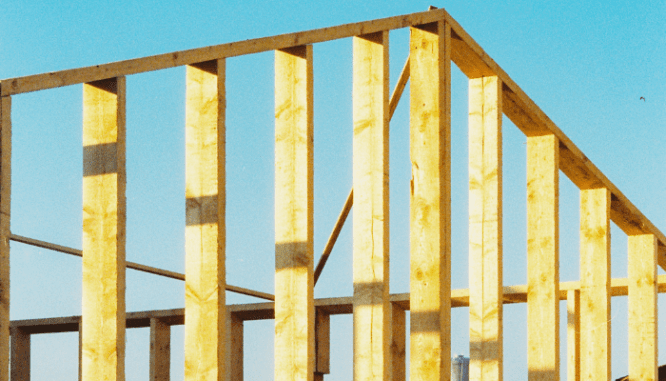 Post and beam construction similar to a saltbox home.