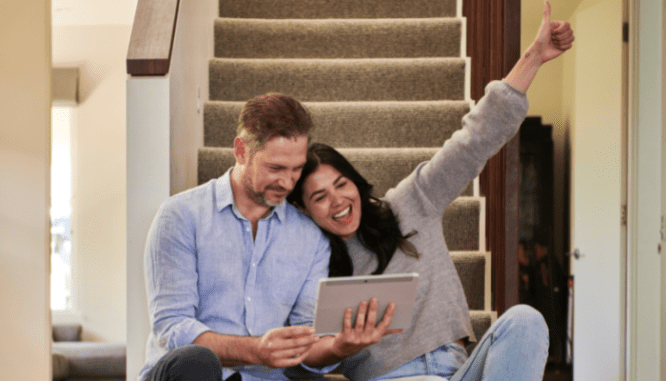 A couple deciding on an open house to attend.