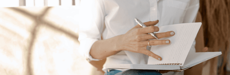 A person making a home appraisal checklist.