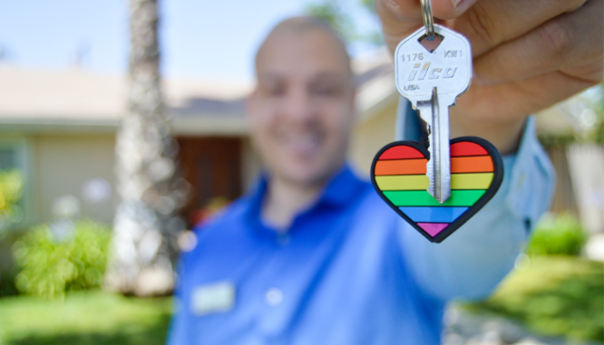 A buyer's agent handing over the keys to a client's new home.